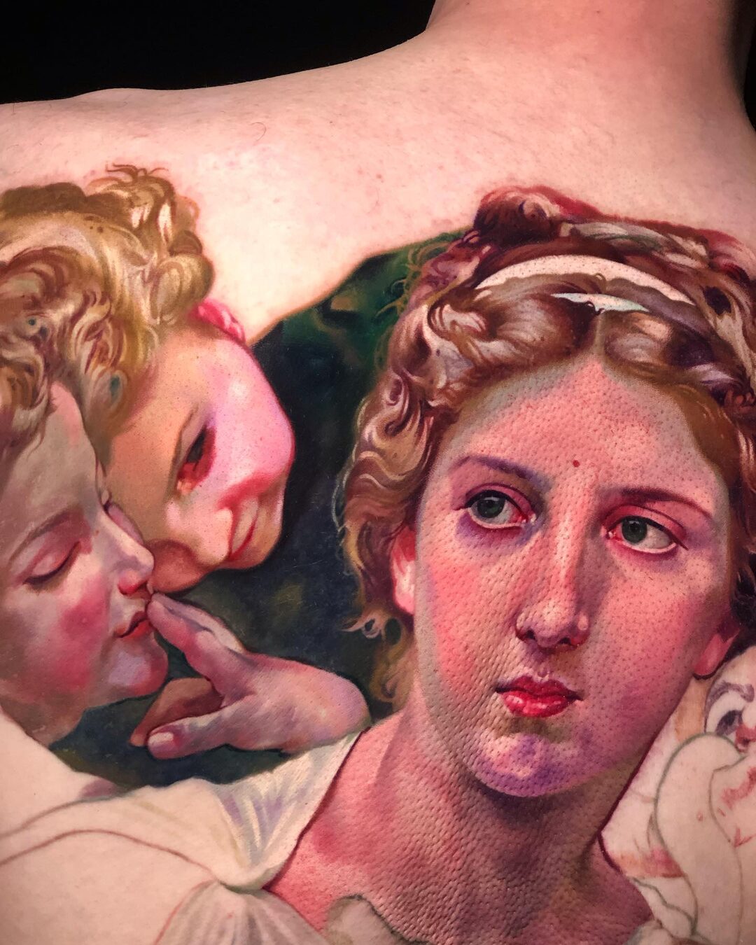 Fine-art color realism tattoo of a Renaissance Madonna and child