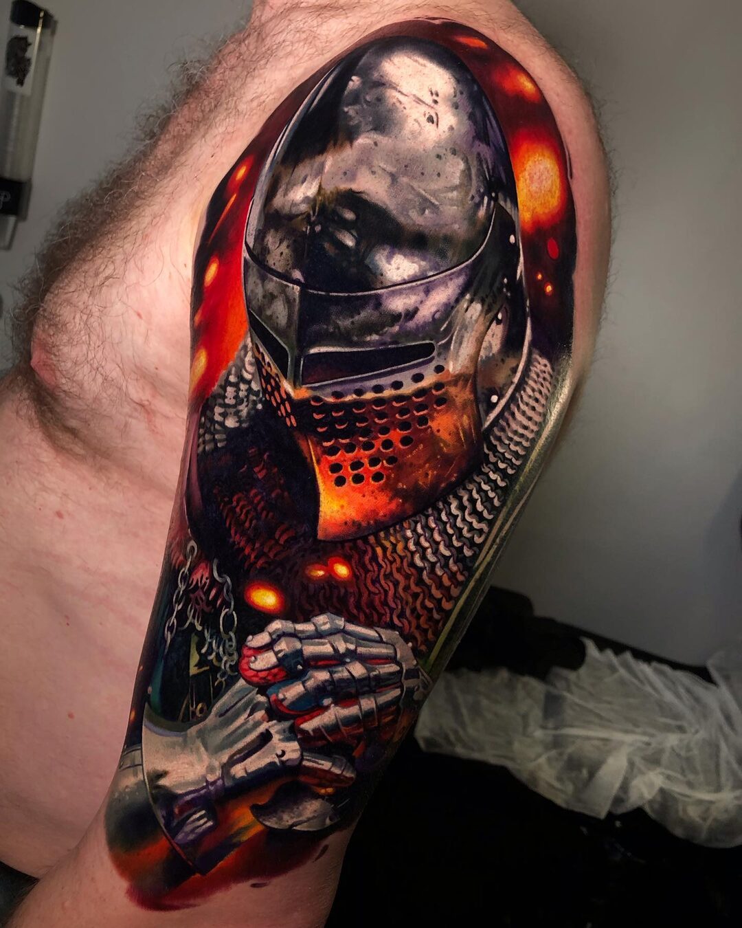 Color realism tattoo of a vintage deep-sea diving helmet on the forearm