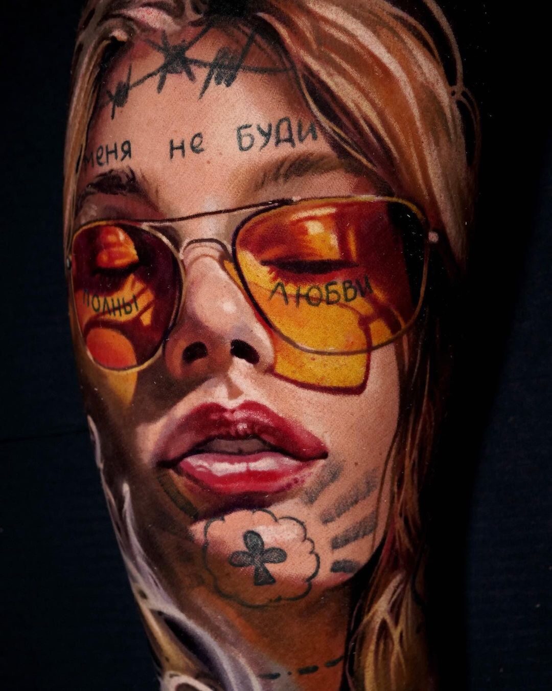 Color realism portrait tattoo of a woman in yellow-tinted sunglasses
